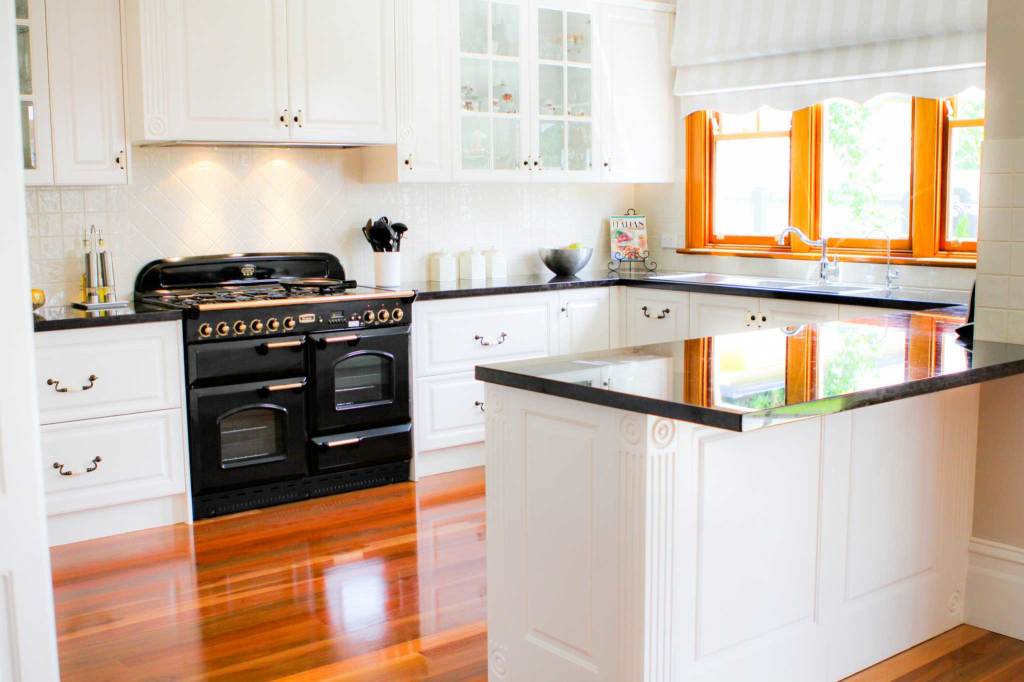 Image of white kitchen with contrasting black features in Coburg.