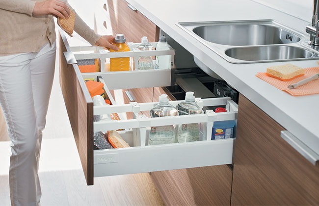 An innovative Blum drawer that runs under and around the sink.